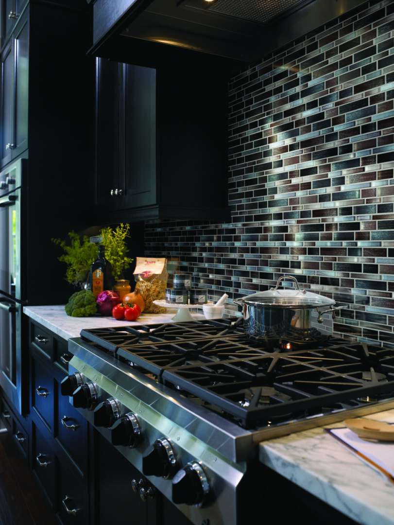 Black-and-White Kitchen Counters, Cabinets, and Stove With Modern Wall Tiles